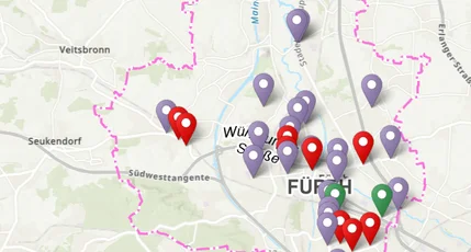 Karte mit roten, grünen und lilanen Markern.